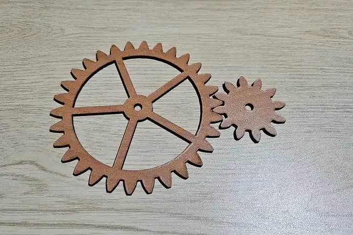 A pair of plywood gears